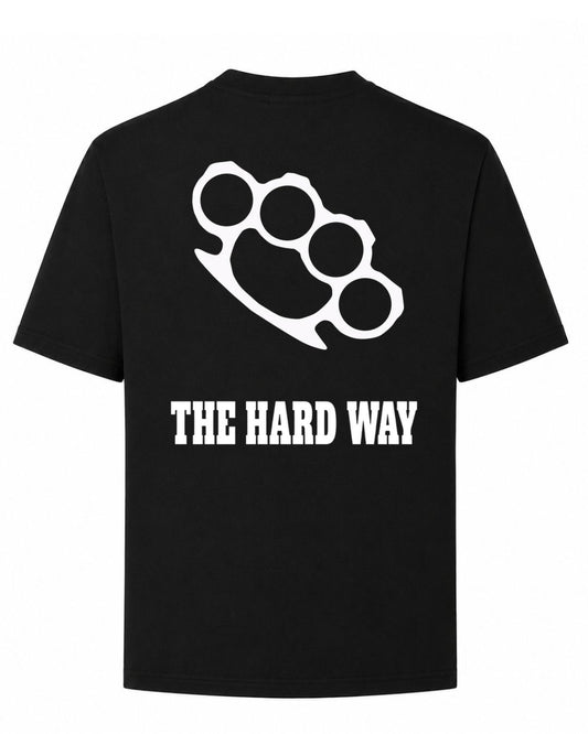 Titan Hard Way Oversized T-shirt in black by BD WEAR featuring a black brass knuckles graphic print and text The Hard Way on a grey background