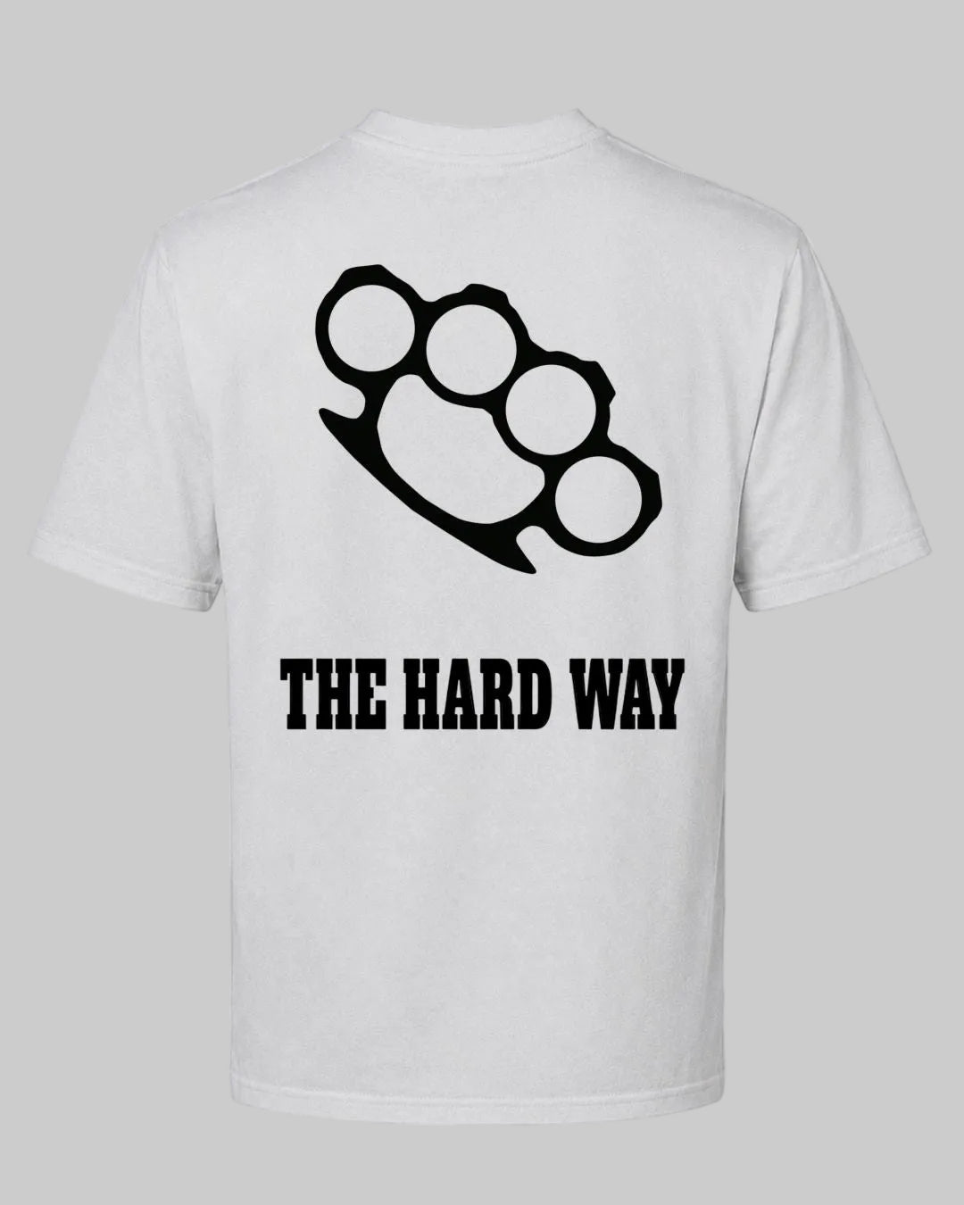 Titan Hard Way Oversized T-shirt in white by BD WEAR featuring a black brass knuckles graphic print and text The Hard Way on a grey background