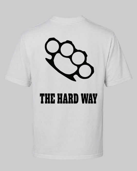 Titan Hard Way Oversized T-shirt in white by BD WEAR featuring a black brass knuckles graphic print and text The Hard Way on a grey background