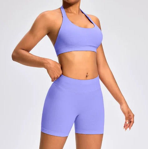 Front view of the Aura Halter Shorts Set in lavender, featuring a backless halter sports bra and high-waisted seamless activewear shorts.