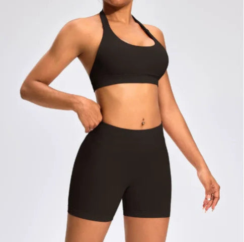 Front view of the Aura Halter Shorts Set in brown, featuring a backless halter sports bra and high-waisted seamless activewear shorts.