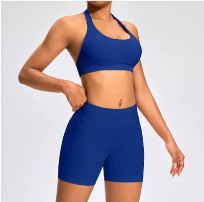 Front view of the Aura Halter Shorts Set in electric blue, featuring a backless halter sports bra and high-waisted seamless activewear shorts.