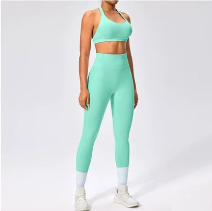 Front view of the Aura Halter Legging Set in green mint, featuring a backless halter sports bra and high-waisted seamless activewear shorts.